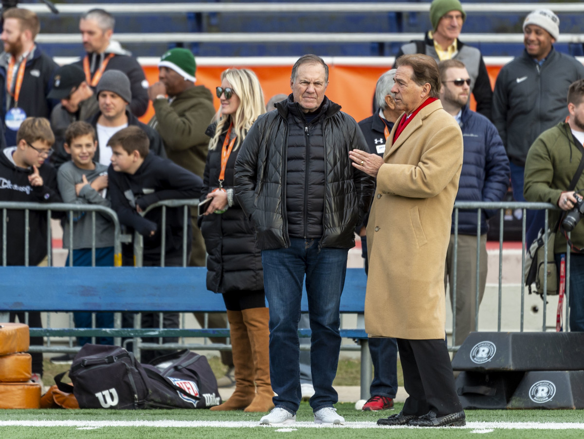 Jan 22, 2020; Mobile, Alabama, USA; Alabama head coach Nick Saban at right talks with New England Patriots head coach Bill Belichick during Senior Bowl practice at Ladd-Peebles Stadium. 